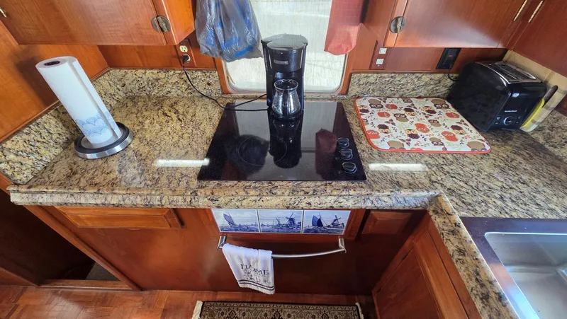 C U Later Yacht Photos Pics Kitchen area of 1987 DeFever 48 Tri Cabin yacht.