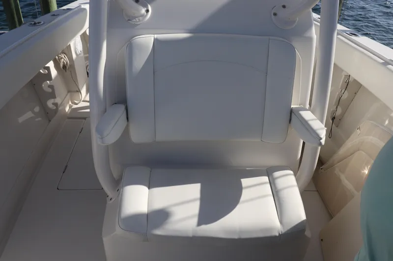  Yacht Photos Pics White seating on a 2013 Jupiter 30 boat, featuring armrests and marine surroundings.