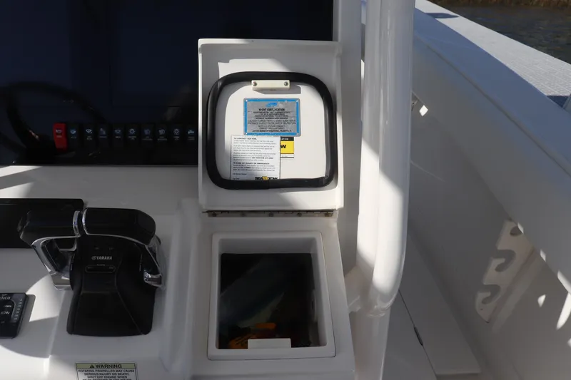  Yacht Photos Pics Control panel and storage compartment on a 2013 Jupiter 30 boat.