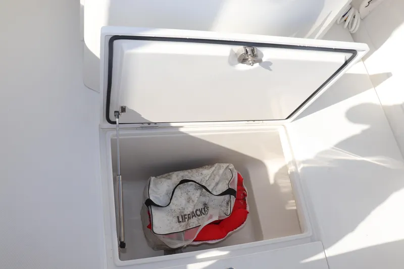  Yacht Photos Pics Open storage compartment on 2013 Jupiter 30 boat with lifejackets inside.