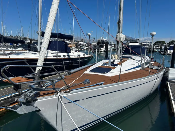Kells Yacht Photos Pics Sailing yacht Nautor Swan 44 Mk II, 1996 model, docked in a marina under clear blue skies.