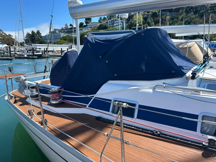 Kells Yacht Photos Pics Sailboat Nautor Swan 44 Mk II, 1996 model, docked with blue cover, sunny marina.