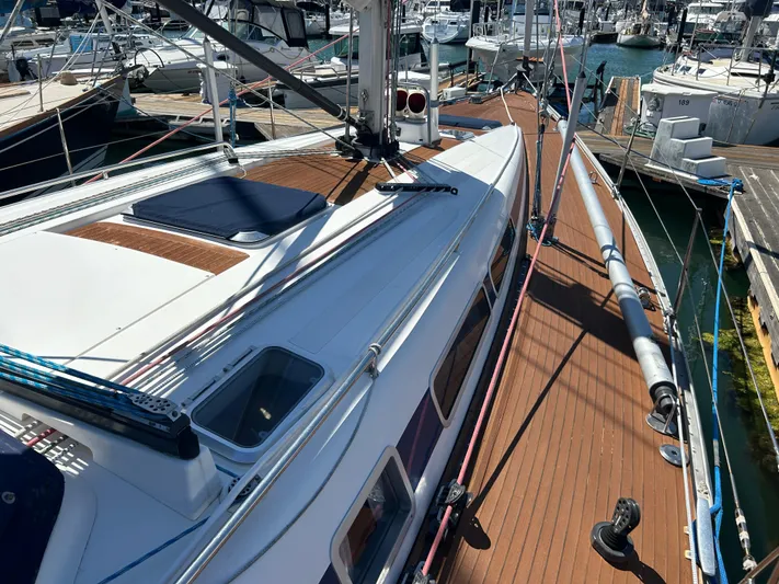 Kells Yacht Photos Pics Nautor Swan 44 Mk II sailboat, 1996 model, docked at marina with wooden deck.