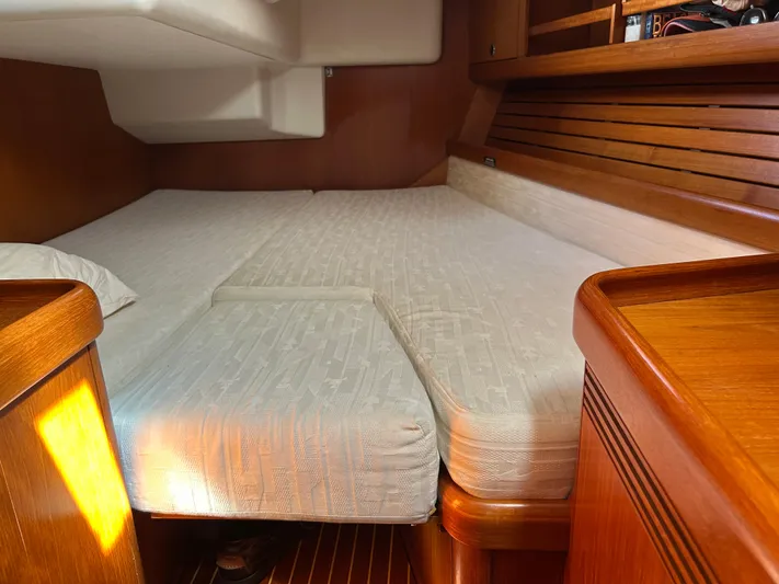 Kells Yacht Photos Pics Cozy cabin interior of 1996 Nautor Swan 44 Mk II yacht with wooden furnishings.