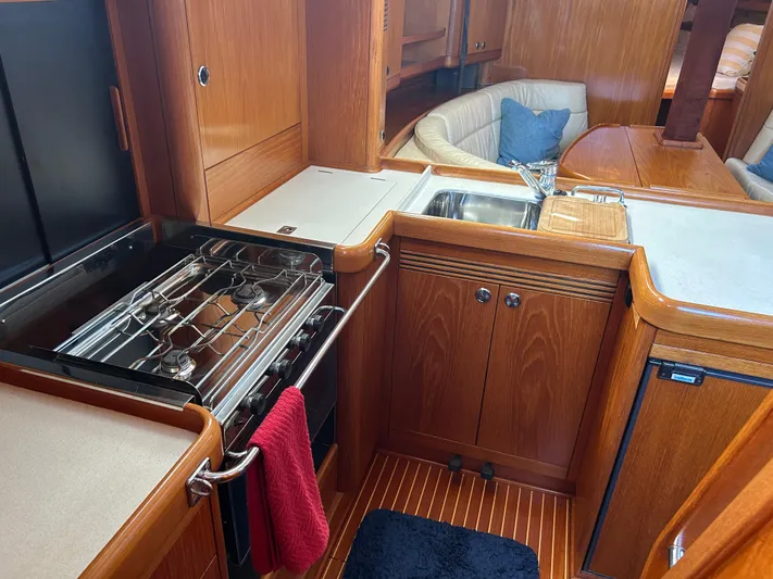 Kells Yacht Photos Pics Interior of 1996 Nautor Swan 44 Mk II yacht, featuring a compact kitchen area.