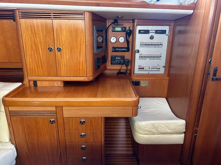 Kells Yacht Photos Pics Nautor Swan 44 Mk II 1996 yacht interior with wooden cabinetry and navigation equipment.