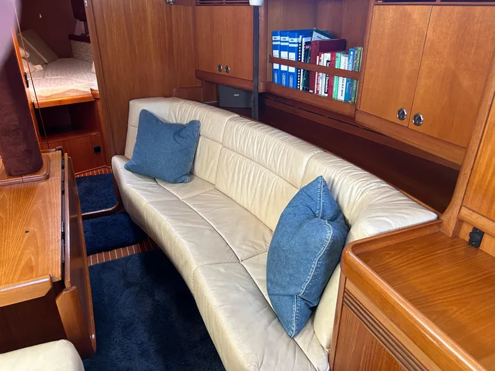 Kells Yacht Photos Pics Interior of 1996 Nautor Swan 44 Mk II yacht with leather seating and wooden cabinetry.