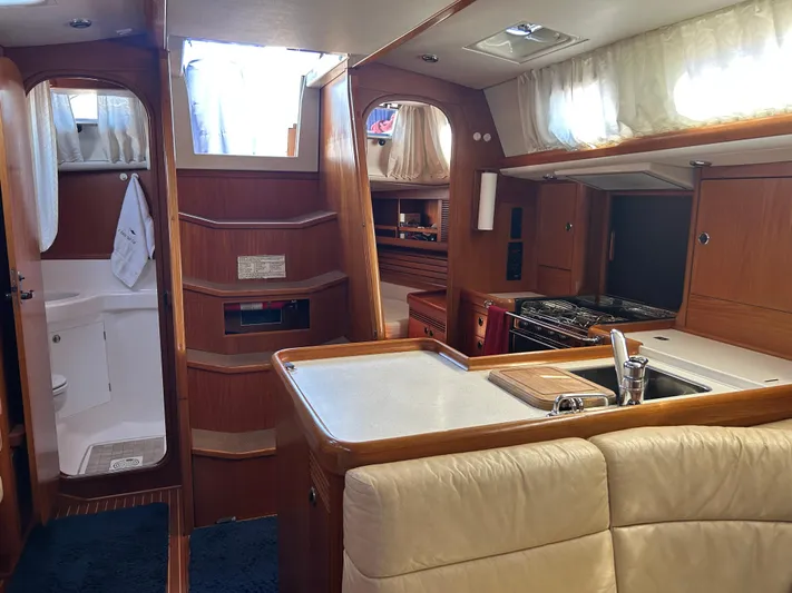 Kells Yacht Photos Pics Interior of 1996 Nautor Swan 44 Mk II yacht with kitchen and seating area.