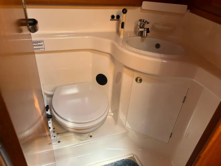 Kells Yacht Photos Pics Bathroom interior of 1996 Nautor Swan 44 Mk II yacht, featuring toilet and sink.