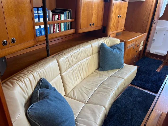 Kells Yacht Photos Pics Luxurious interior of 1996 Nautor Swan 44 Mk II yacht with leather seating and wooden cabinetry.