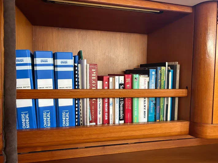 Kells Yacht Photos Pics Bookshelf with Nautor Swan 44 Mk II manuals and various sailing books, 1996 model.