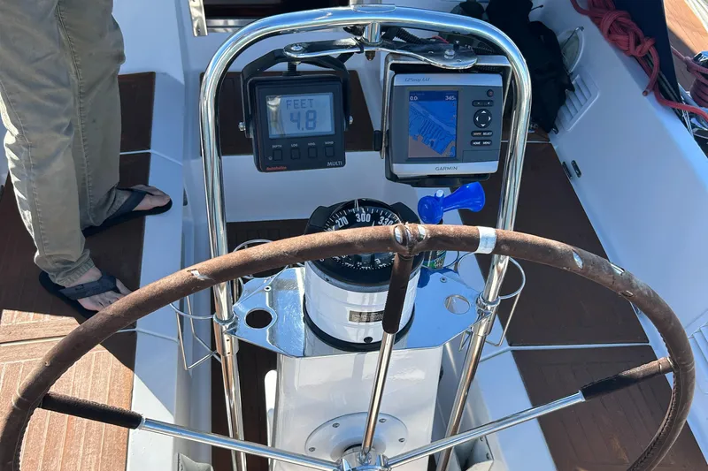 Kells Yacht Photos Pics Steering wheel and navigation instruments on a 1996 Nautor Swan 44 Mk II sailboat.