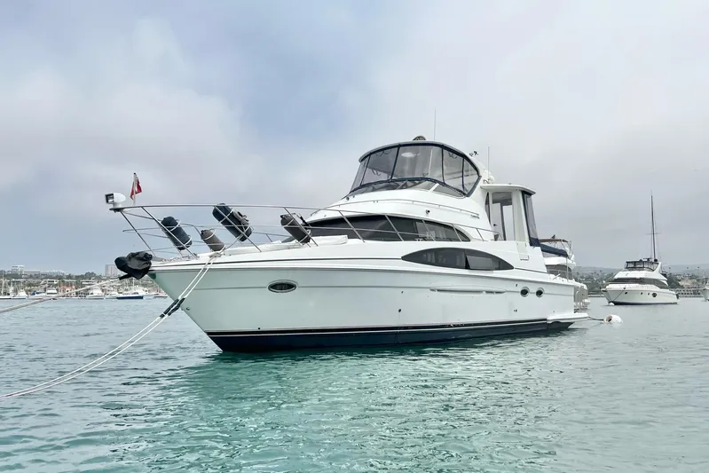  Yacht Photos Pics 2003 Carver 444 Cockpit Motor Yacht anchored in calm waters.