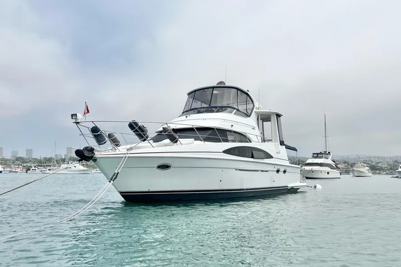  Yacht Photos Pics 2003 Carver 444 Cockpit Motor Yacht anchored in a serene harbor setting.