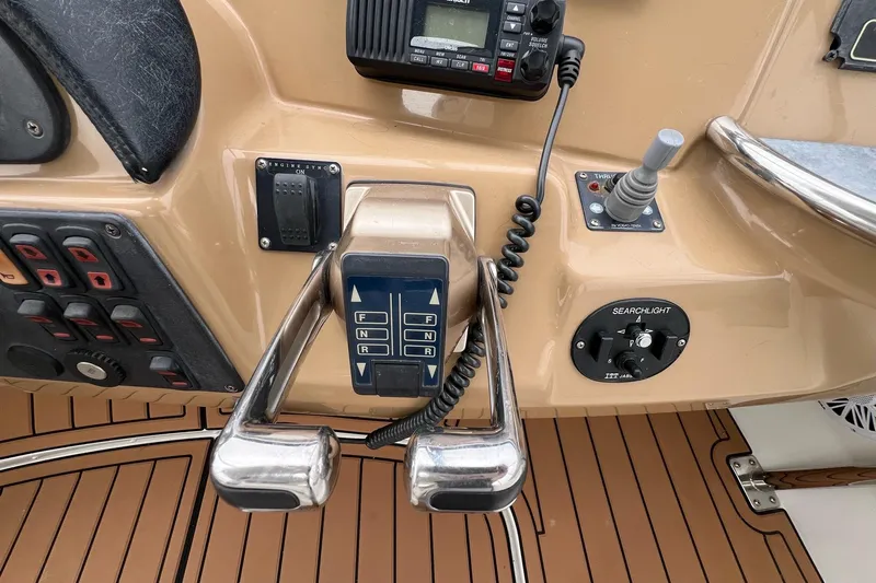  Yacht Photos Pics Control panel of a 2003 Carver 444 Cockpit Motor Yacht with throttle and navigation controls.