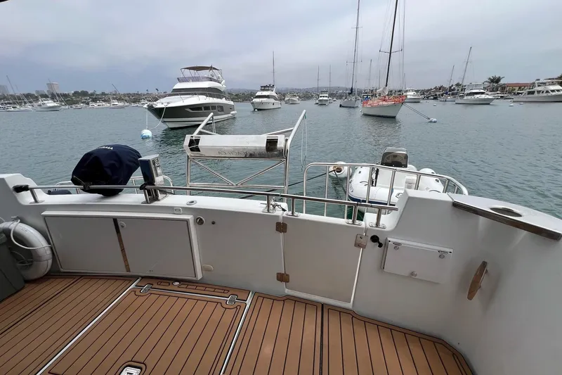  Yacht Photos Pics 2003 Carver 444 Cockpit Motor Yacht docked in a busy marina.