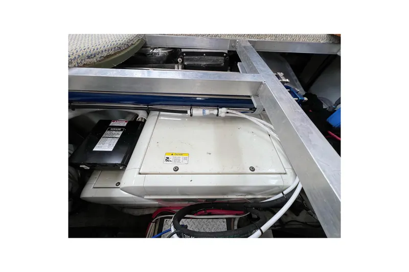  Yacht Photos Pics Engine compartment of 2003 Carver 444 Cockpit Motor Yacht, showing mechanical components.