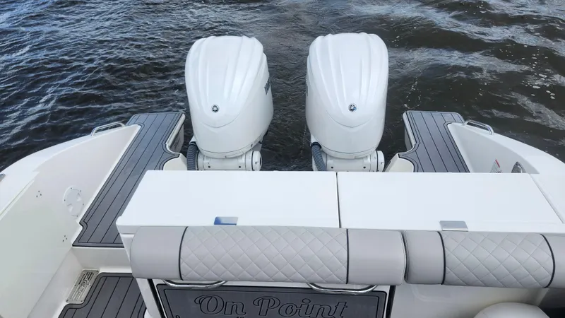  Yacht Photos Pics 2023 Pursuit OS 325 Offshore boat with dual engines on water.