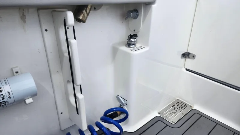  Yacht Photos Pics 2023 Pursuit OS 325 Offshore boat deck with hose and fittings.