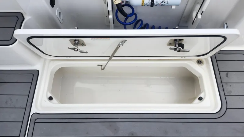  Yacht Photos Pics Open storage compartment on 2023 Pursuit OS 325 Offshore boat deck.