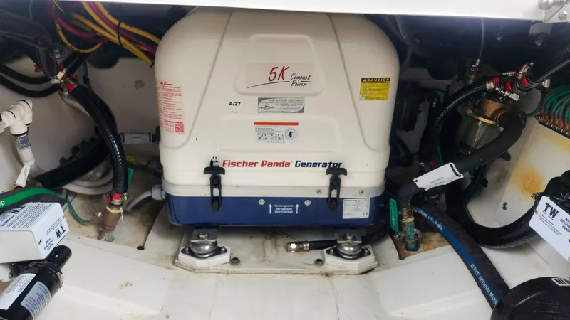  Yacht Photos Pics Fischer Panda generator in 2023 Pursuit OS 325 Offshore boat engine compartment.
