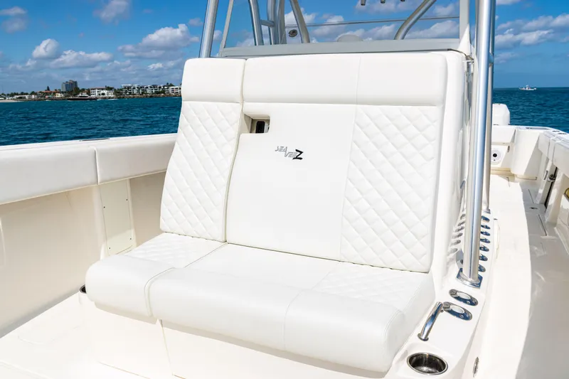  Yacht Photos Pics 2018 SeaVee 370Z boat with white seating, ocean backdrop, and clear skies.