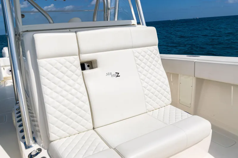  Yacht Photos Pics 2018 SeaVee 370Z boat with white quilted seating, ocean backdrop.