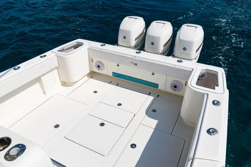  Yacht Photos Pics 2018 SeaVee 370Z boat deck with triple Mercury outboard engines on open water.
