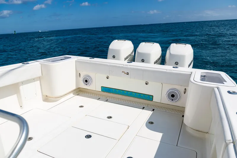 Yacht Photos Pics 2018 SeaVee 370Z boat deck with triple outboard motors on open ocean.