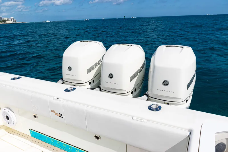  Yacht Photos Pics 2018 SeaVee 370Z boat with triple Mercury outboard engines on open ocean.