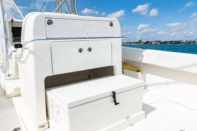  Yacht Photos Pics 2018 SeaVee 370Z boat interior with storage compartment, ocean view, and clear blue sky.