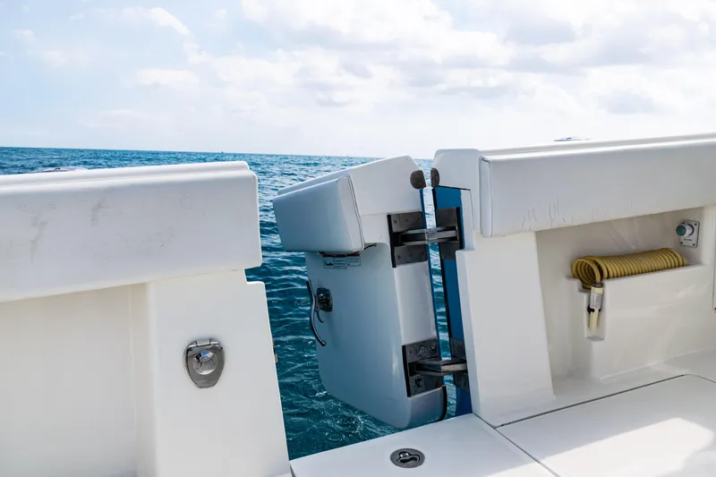  Yacht Photos Pics 2018 SeaVee 370Z boat with open transom door, ocean view in background.