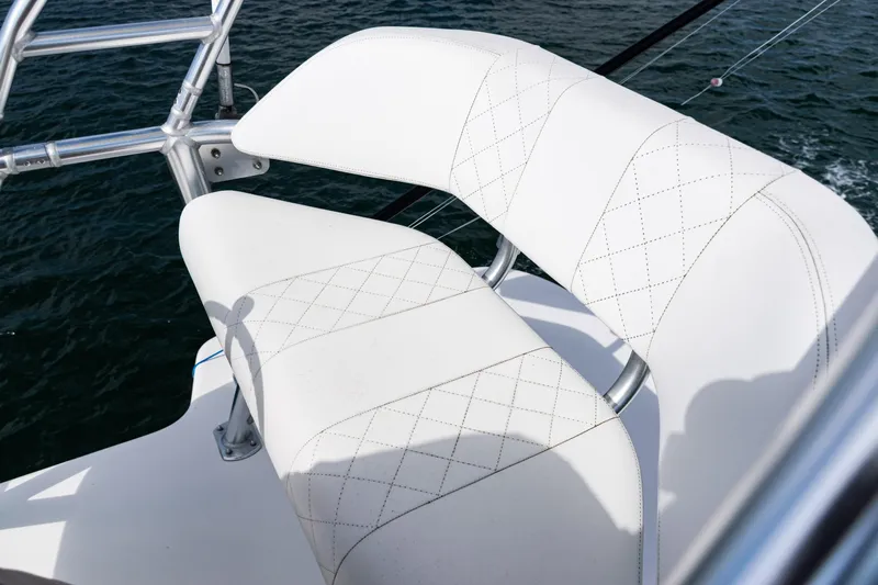  Yacht Photos Pics White cushioned seating on 2018 SeaVee 370Z boat, overlooking water.