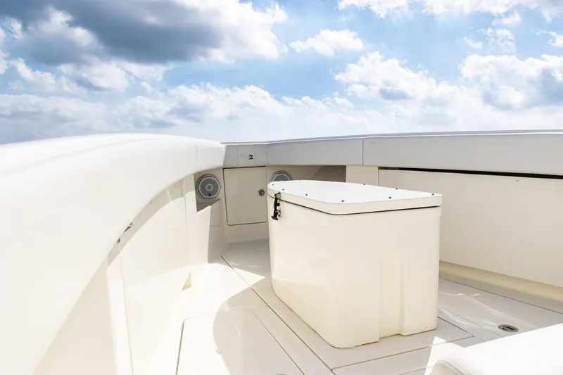  Yacht Photos Pics 2018 SeaVee 370Z boat deck with storage box under a cloudy sky.