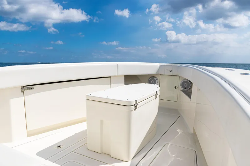  Yacht Photos Pics 2018 SeaVee 370Z boat deck with storage, under a clear blue sky.