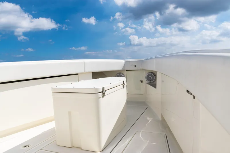  Yacht Photos Pics 2018 SeaVee 370Z boat deck with storage compartment under a clear blue sky.