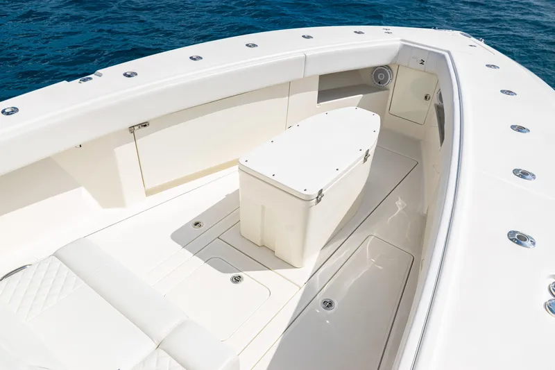  Yacht Photos Pics 2018 SeaVee 370Z boat interior with seating and storage, on calm blue water.