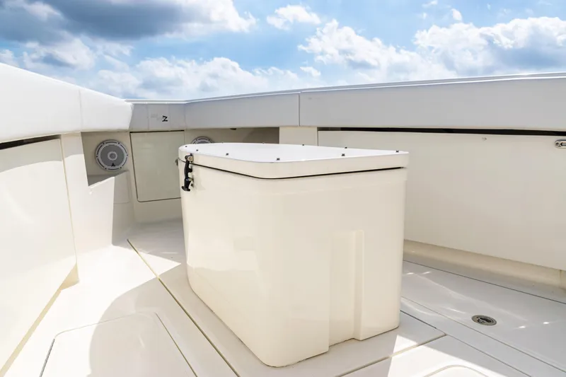  Yacht Photos Pics 2018 SeaVee 370Z boat deck with storage box under a blue sky.