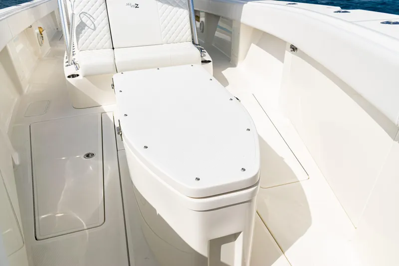  Yacht Photos Pics 2018 SeaVee 370Z boat interior with white seating and storage compartment.