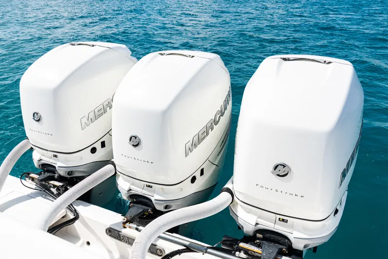  Yacht Photos Pics Triple Mercury outboard engines on a 2018 SeaVee 370Z boat in blue ocean water.