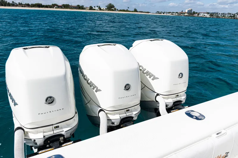  Yacht Photos Pics Three Mercury FourStroke engines on a 2018 SeaVee 370Z boat in open water.