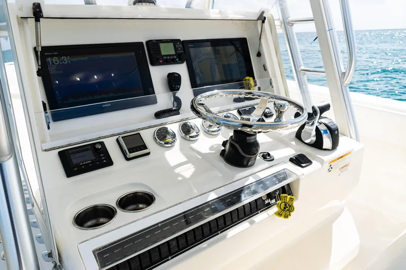  Yacht Photos Pics Control panel of a 2018 SeaVee 370Z boat with navigation equipment.