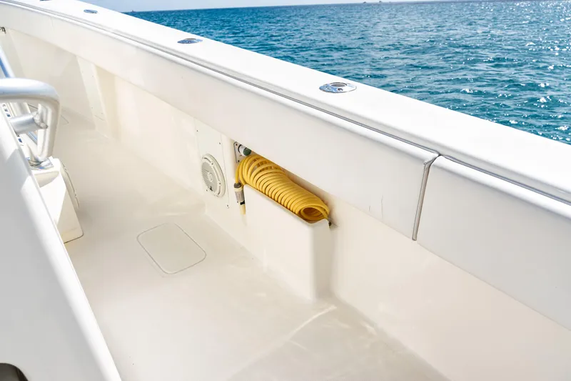  Yacht Photos Pics 2018 SeaVee 370Z boat deck with coiled yellow hose, ocean view.
