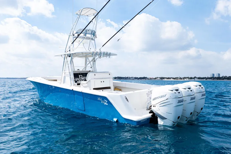  Yacht Photos Pics 2018 SeaVee 370Z boat with triple Mercury engines on open water.