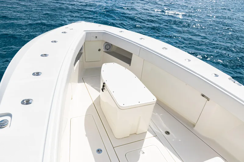  Yacht Photos Pics 2018 SeaVee 370Z boat deck with storage, surrounded by ocean waters.