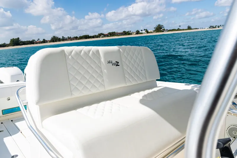  Yacht Photos Pics 2018 SeaVee 370Z boat with white cushioned seating, ocean backdrop.