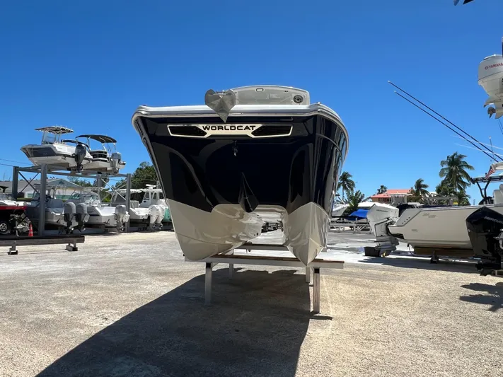  Yacht Photos Pics 2024 World Cat 260 CC-X boat on display in a sunny marina setting.