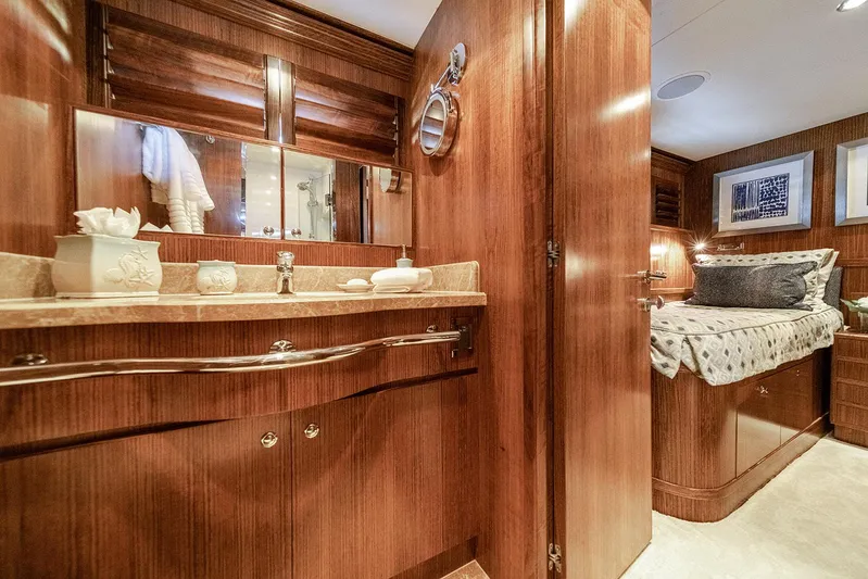 Dark Horse Yacht Photos Pics Luxurious 2007 Hargrave 78 Open Bridge yacht interior with elegant wood finishes and cozy bedroom.