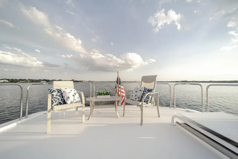 Dark Horse Yacht Photos Pics Luxury deck of 2007 Hargrave 78 Open Bridge yacht with seating and ocean view.