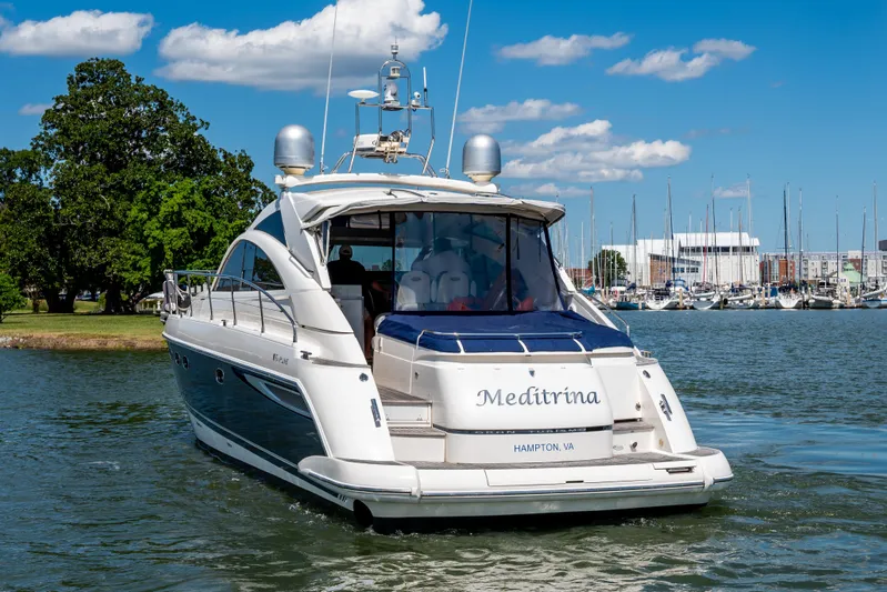 Ami Kids Donation: Meditrina Yacht Photos Pics 2006 Fairline Targa 47 GT yacht on water, sunny day, marina background.